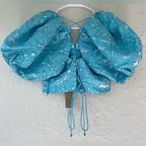 DO+BE light blue/floral crop top, oversize puff sleeves, lace up back corset; M